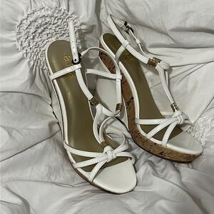 White and gold cork wedge heel.